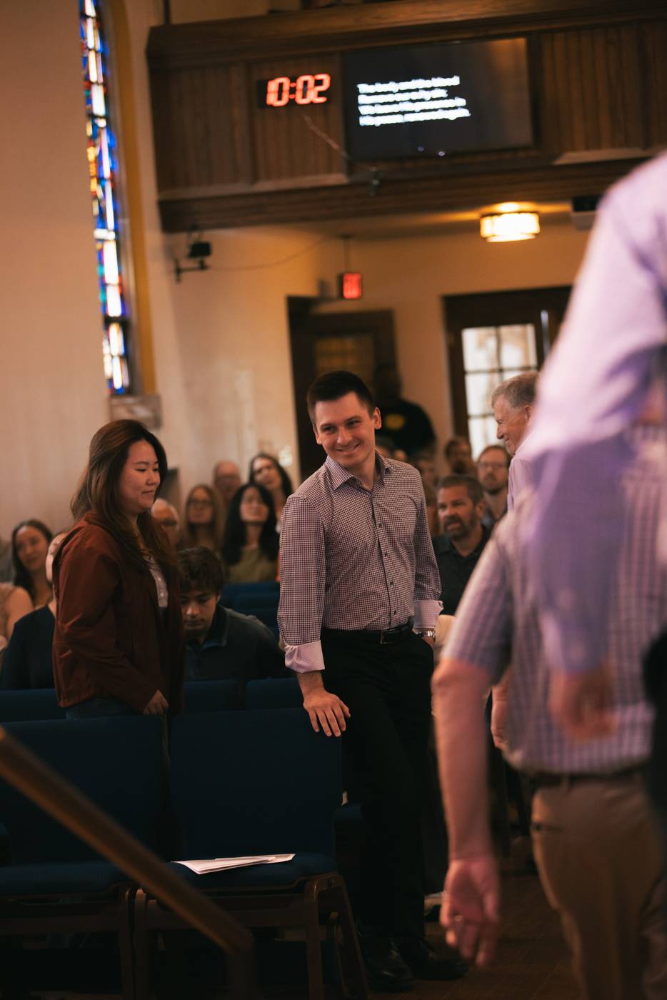 Multi-generational fellowship during worship at ULC